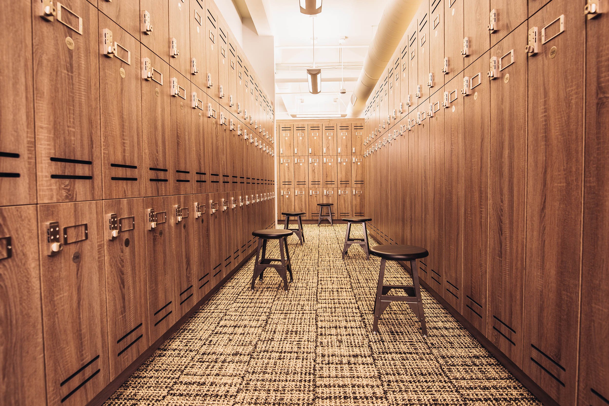 Los Angeles Athletic Club locker room filled with stools.